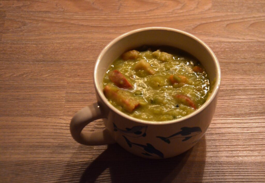 Split Pea Soup in a bowl with dolphins on the side 