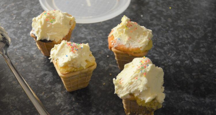 Ice cream cone cupcakes, 4 decorated on the kitchen counter