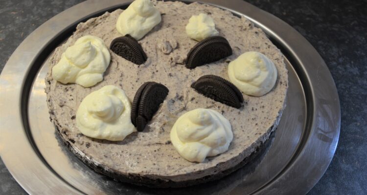 No Bake Oreo Cheesecake served on a silver colored platter
