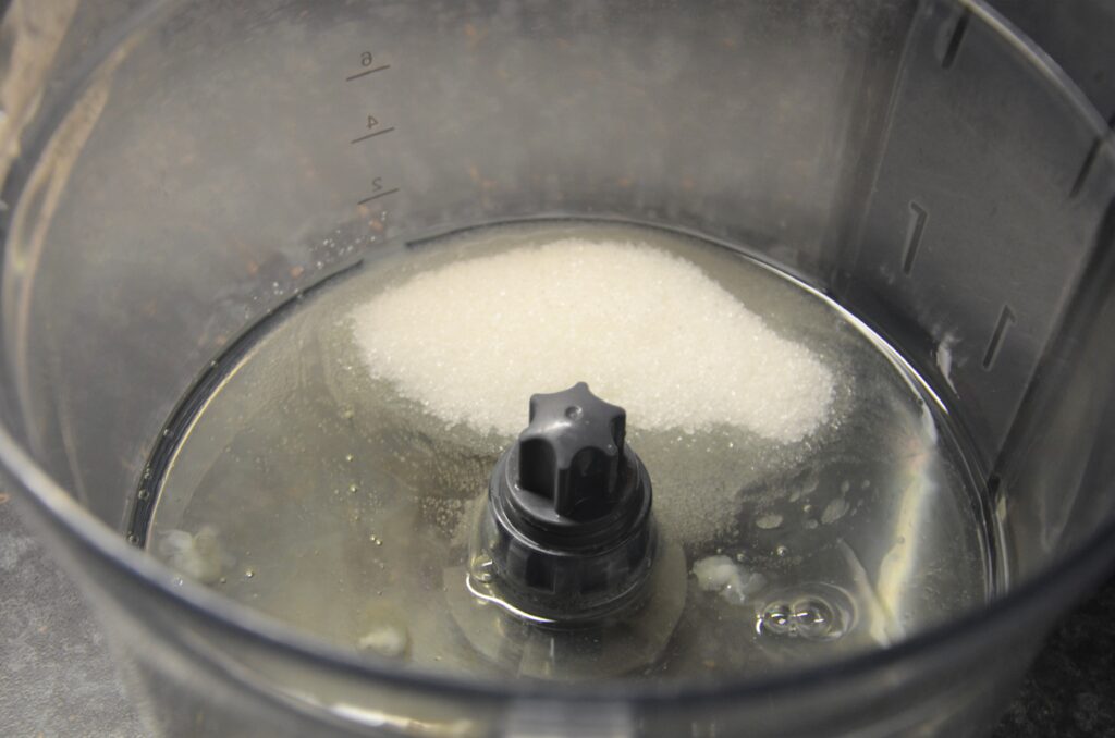 Egg whites and sugar, in a food processor bowl