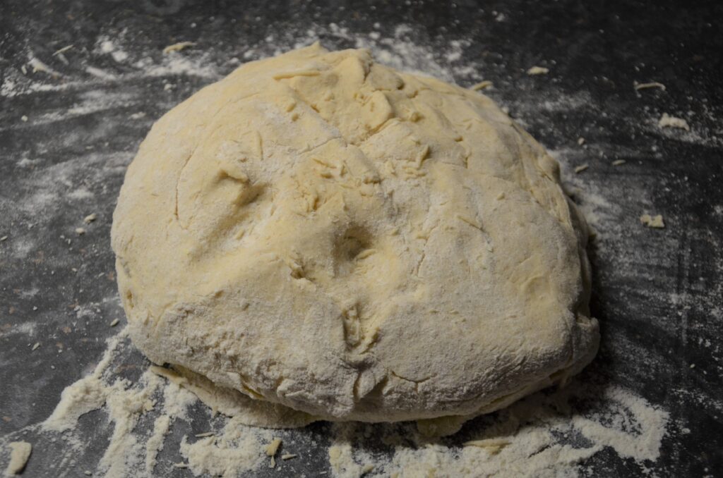 Kneading the dough, on the kitchen counter in flour