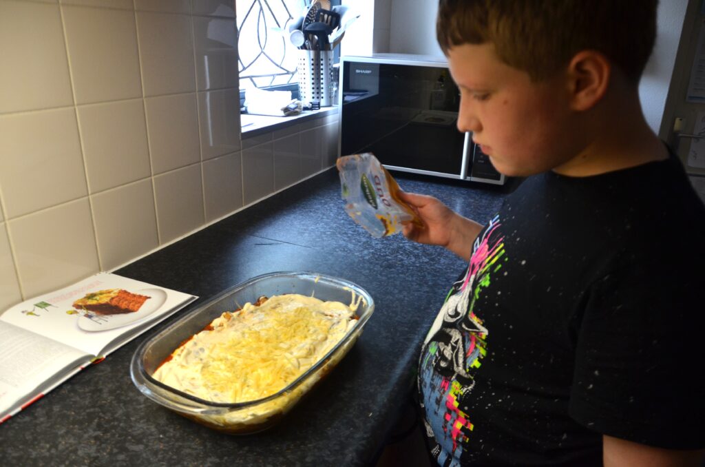 Last layer of grated cheese in a casserole dish