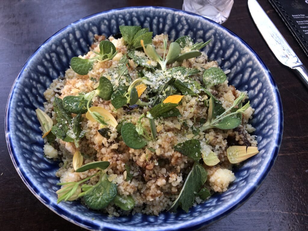 Couscous explosion in a blue and white bowl