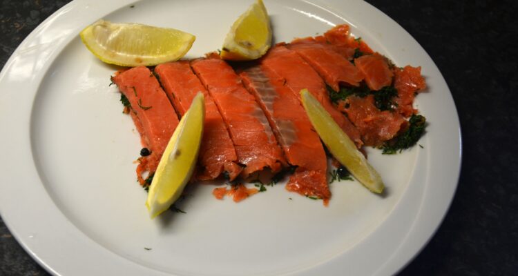 Gravad Lax served on a white plate